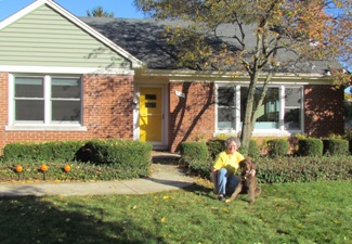 Bogie with his mom in front of the new house.