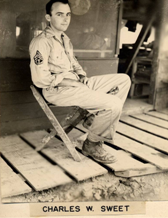 Charlie sitting in uniform.